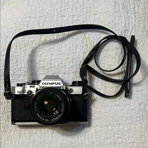 Olympus Silver and Black 35mm Film SLR with Lens and Strap